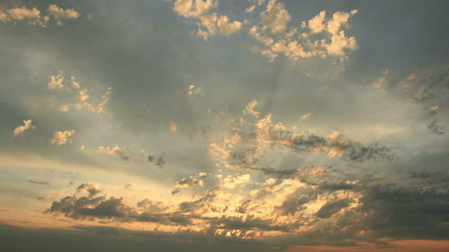 Orange Clouds With Sunbeams