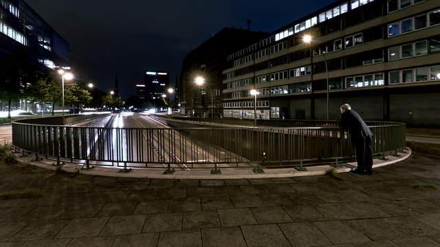 Man standing on a bridge