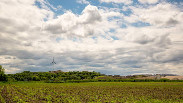 Field with Wind Turbine and Allianz Arena