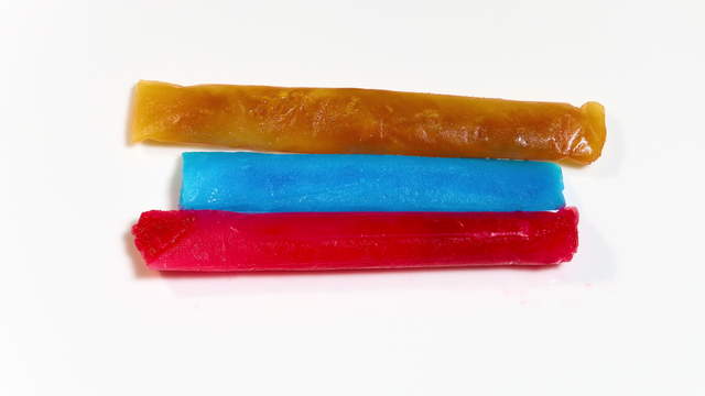Timelapse of Colored Popsicles Melting